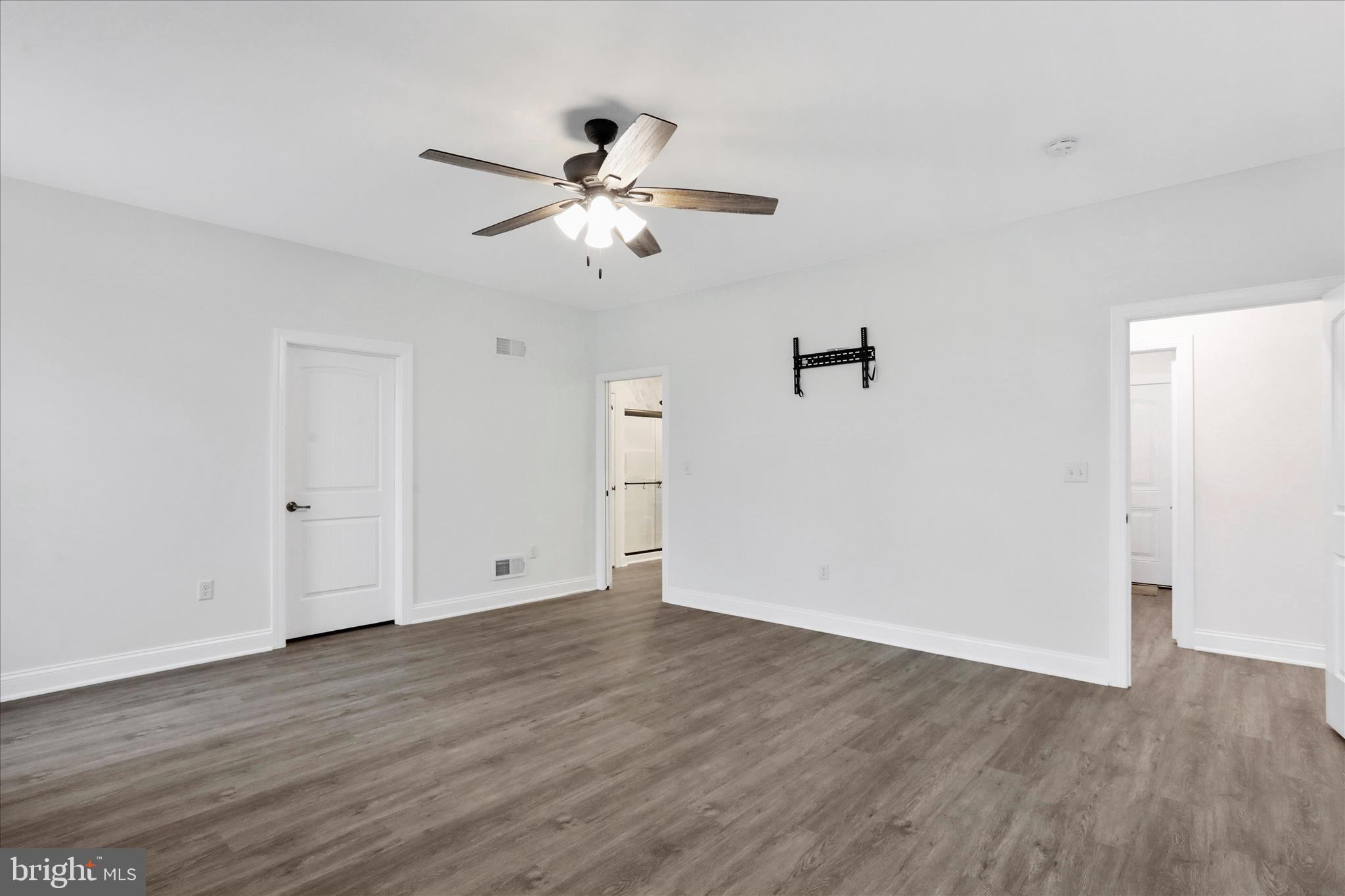 41 Smith Circle Littlestown, PA 17340 - Photo 16 of 53 an empty room with wooden floor fan and windows