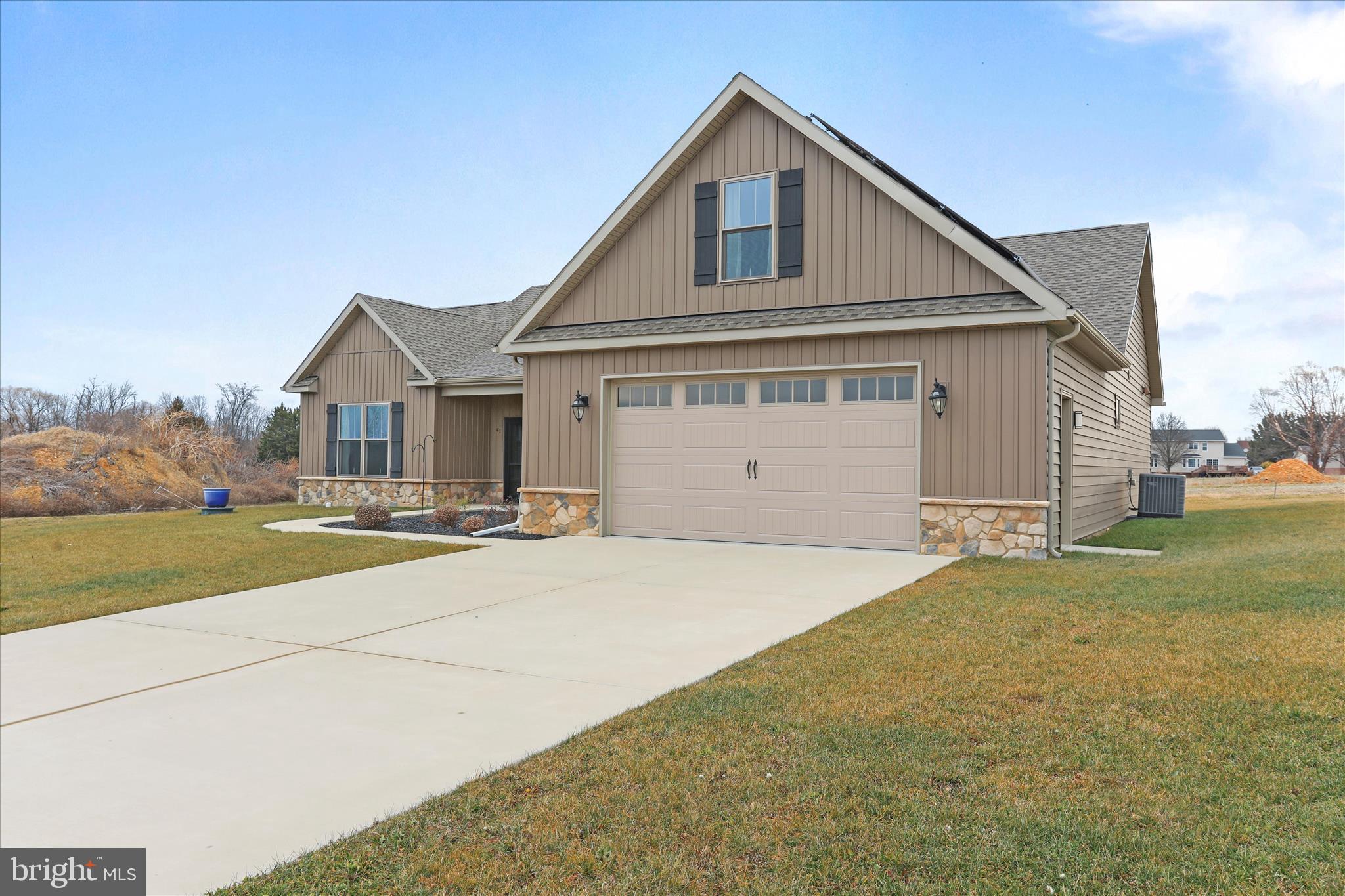 41 Smith Circle Littlestown, PA 17340 - Photo 37 of 53 a front view of a house with a garden and yard