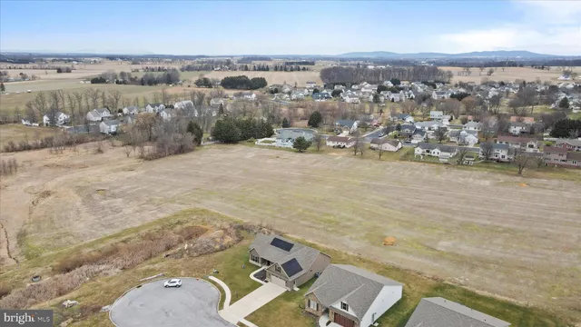 an aerial view of a house with a lake view