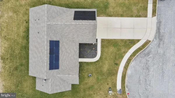 an aerial view of a house with a lake view
