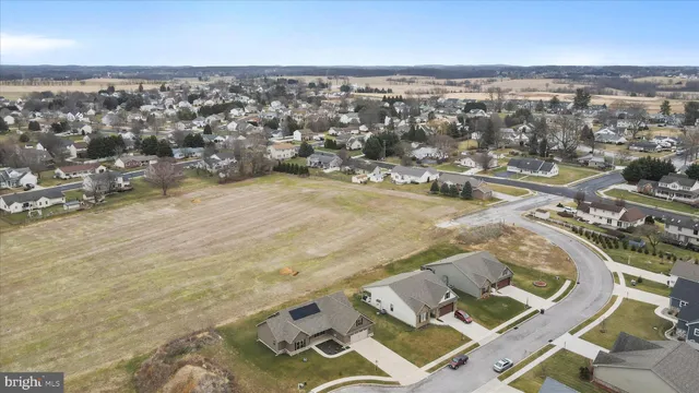 an aerial view of a house with a ocean view