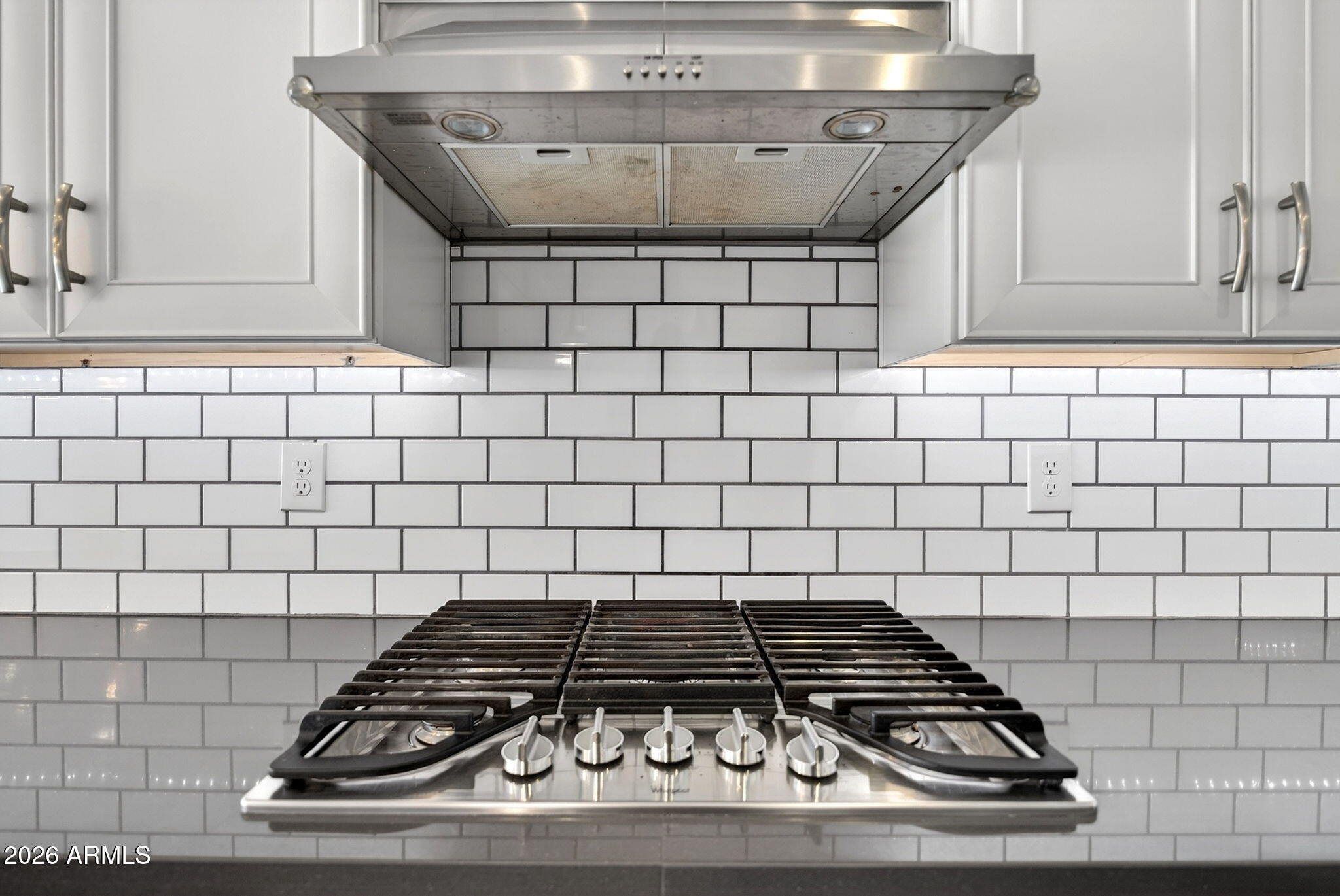 12124 West Peak View Road Peoria, AZ 85383 - Photo 5 of 38 a stove top oven sitting inside of a kitchen