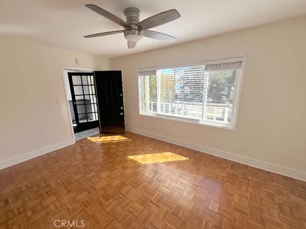 a view of an empty room with a window