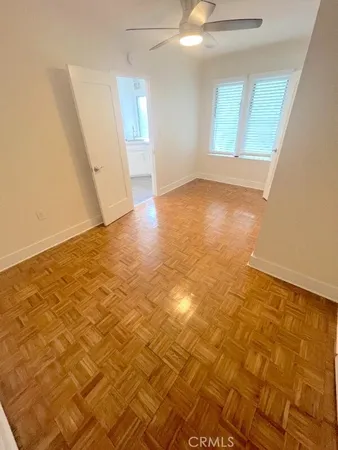 an empty room with wooden floor