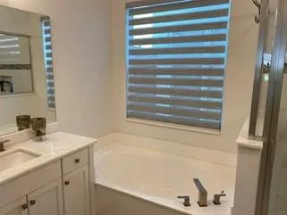 a bathroom with a sink and a bathtub