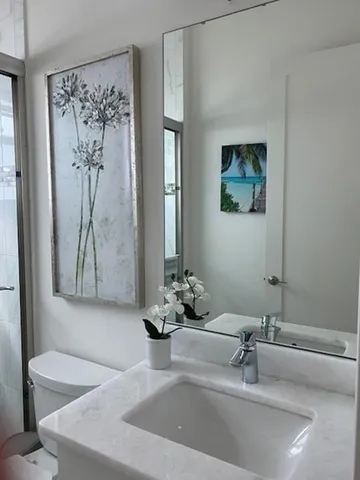 a bathroom with a bathtub sink and mirror