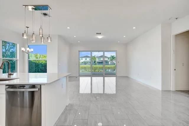 a bathroom with a double vanity sink window and a mirror