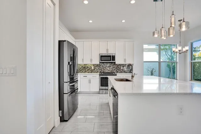 a view of a lake with houses in the back