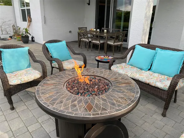 a view of a swimming pool with a patio