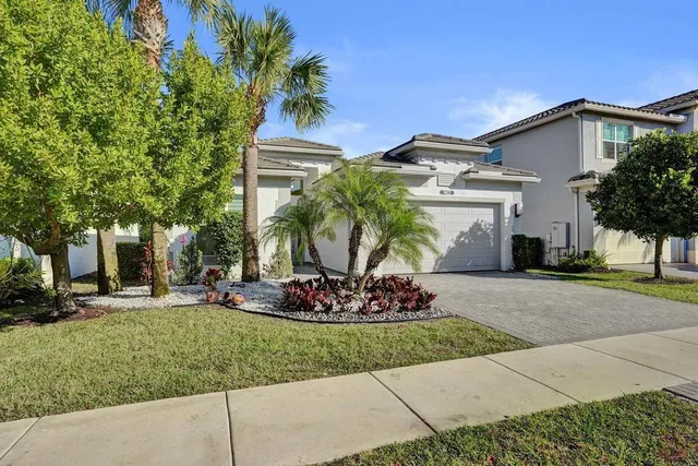 a view of a hallway with wooden floor and a large window
