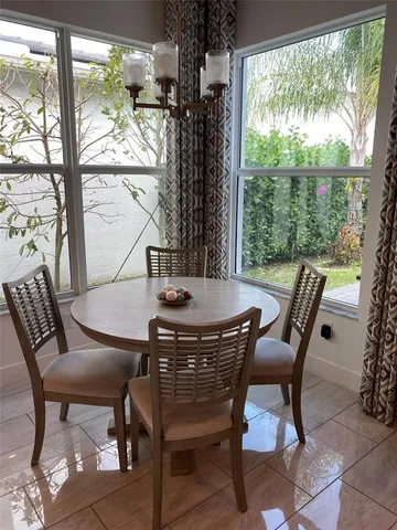 a view of a dining room with furniture window and outside view