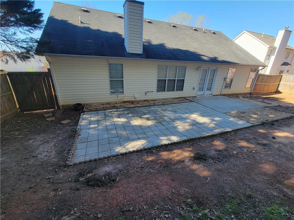2213 Carlton Chase Road Dacula, GA 30019 - Photo 29 of 30 a view of a house with a yard
