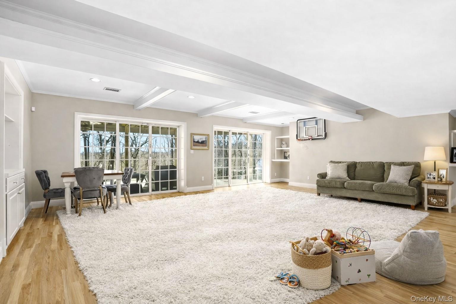 2 Hemlock Rise Armonk, NY 10504 - Photo 32 of 48 Expansive 26' x 20' Walkout lower level with sliders to backyard and stone patio