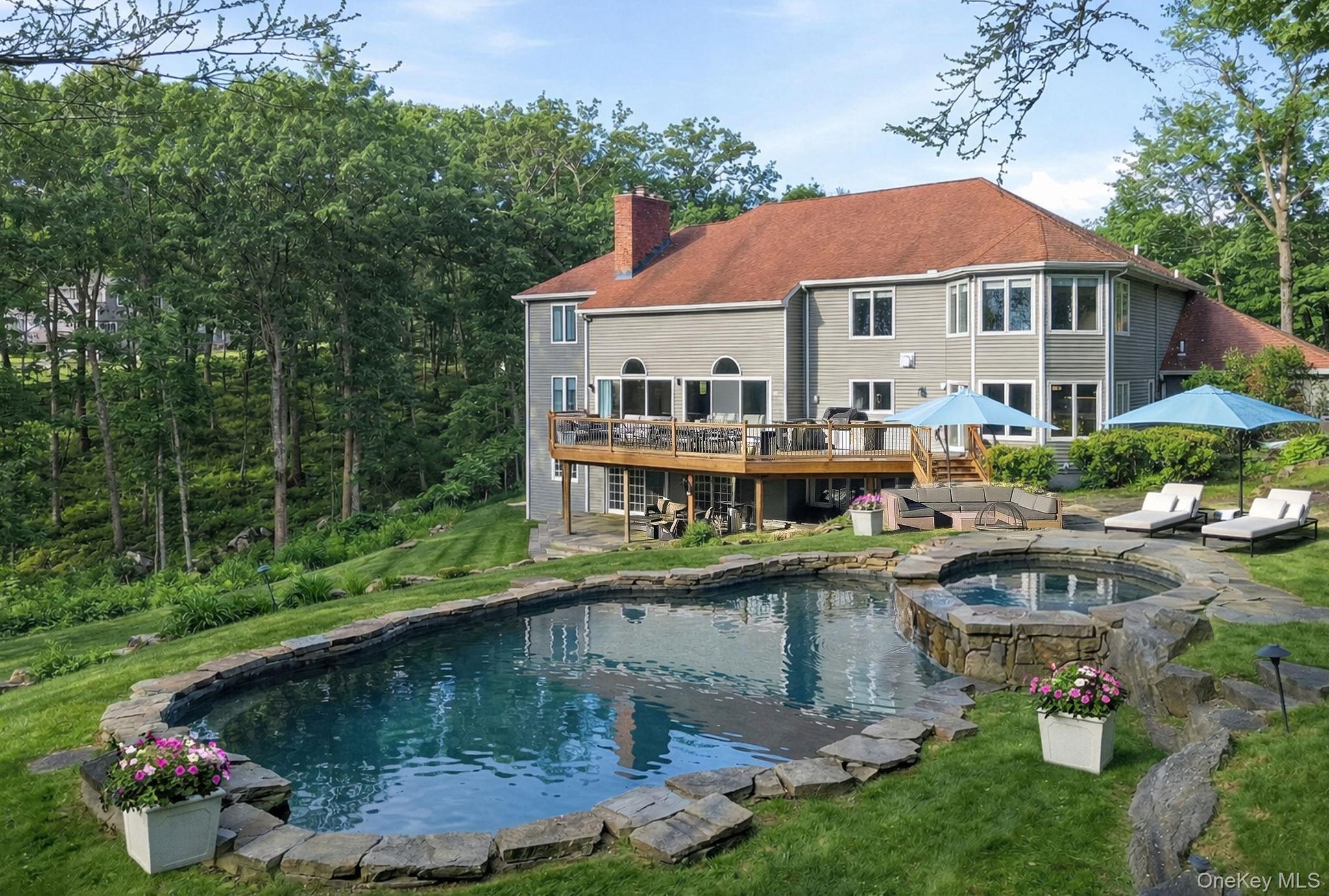 2 Hemlock Rise Armonk, NY 10504 - Photo 39 of 48 a front view of a house with swimming pool