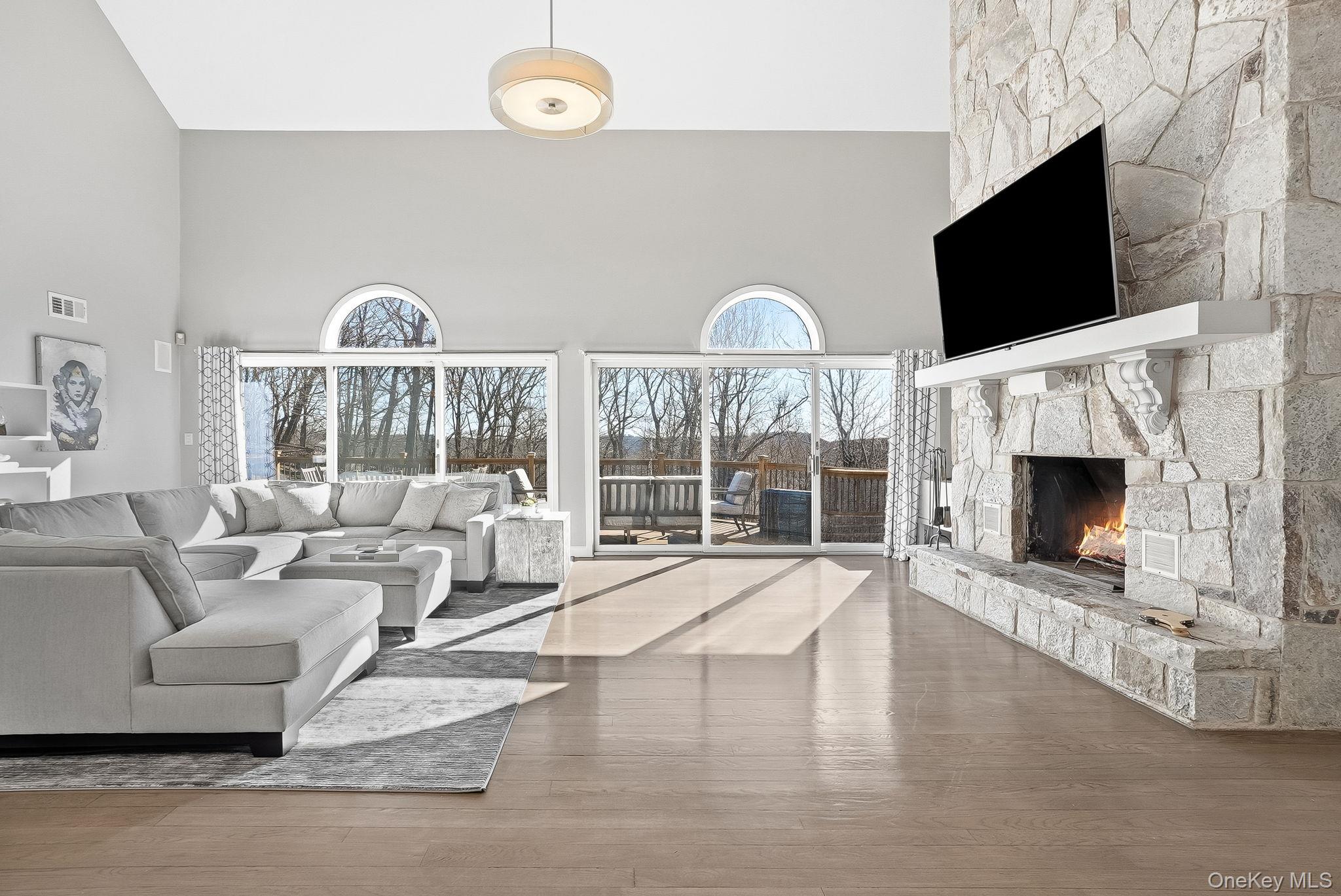 2 Hemlock Rise Armonk, NY 10504 - Photo 9 of 48 The Great Room room has double sliders that lead to the expansive deck and summer kitchen