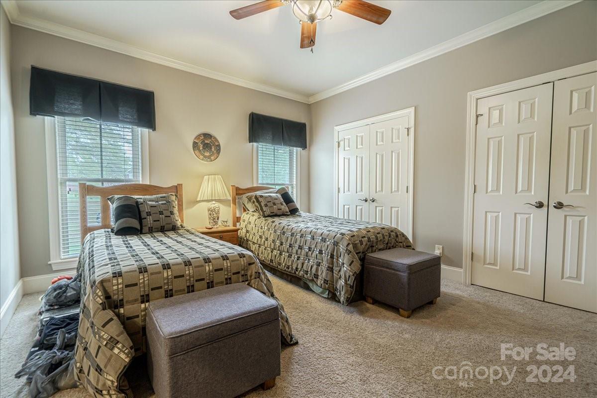 545 State Rd S-13-756 Chesterfield, SC 29709 - Photo 14 of 45 a bedroom with two beds and a chandelier