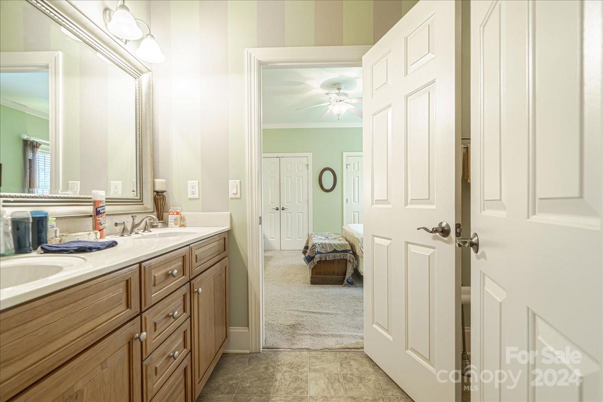 545 State Rd S-13-756 Chesterfield, SC 29709 - Photo 16 of 45 a spacious bathroom with a double vanity sink a mirror and a shower
