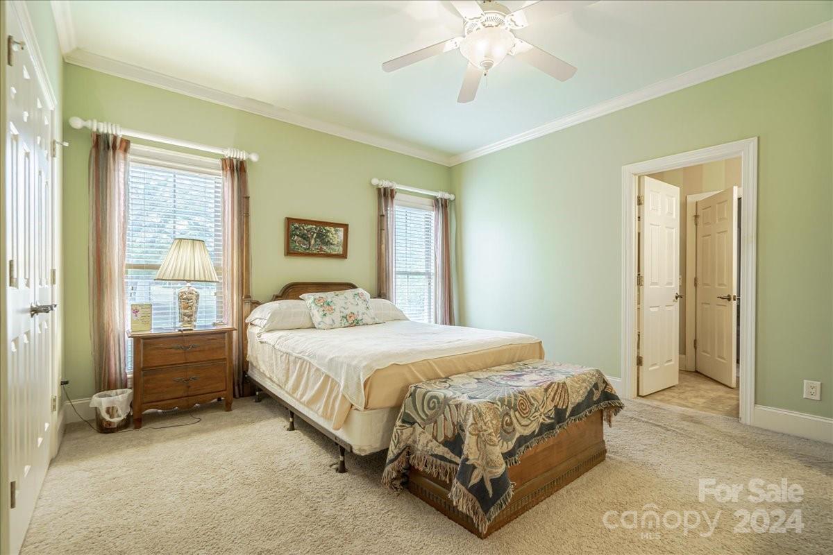 545 State Rd S-13-756 Chesterfield, SC 29709 - Photo 18 of 45 a bedroom with a bed and a chandelier