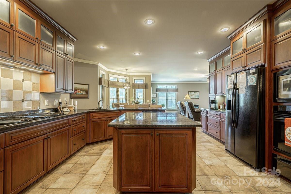 545 State Rd S-13-756 Chesterfield, SC 29709 - Photo 20 of 45 a kitchen with stainless steel appliances granite countertop a sink stove and refrigerator