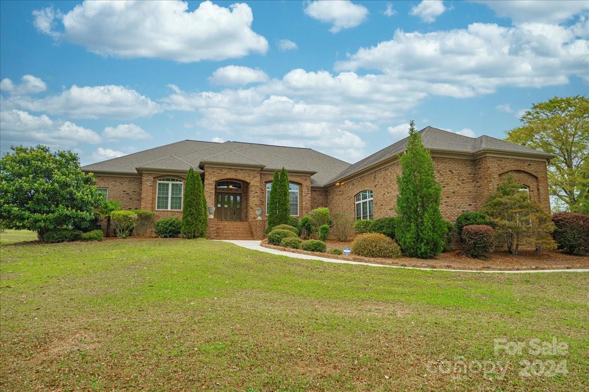 545 State Rd S-13-756 Chesterfield, SC 29709 - Photo 2 of 45 a front view of a house with garden and porch