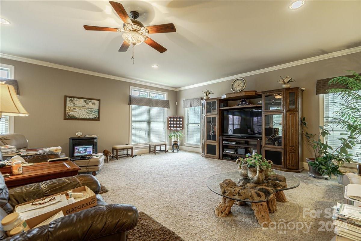 545 State Rd S-13-756 Chesterfield, SC 29709 - Photo 24 of 45 a living room with furniture a window and a flat screen tv
