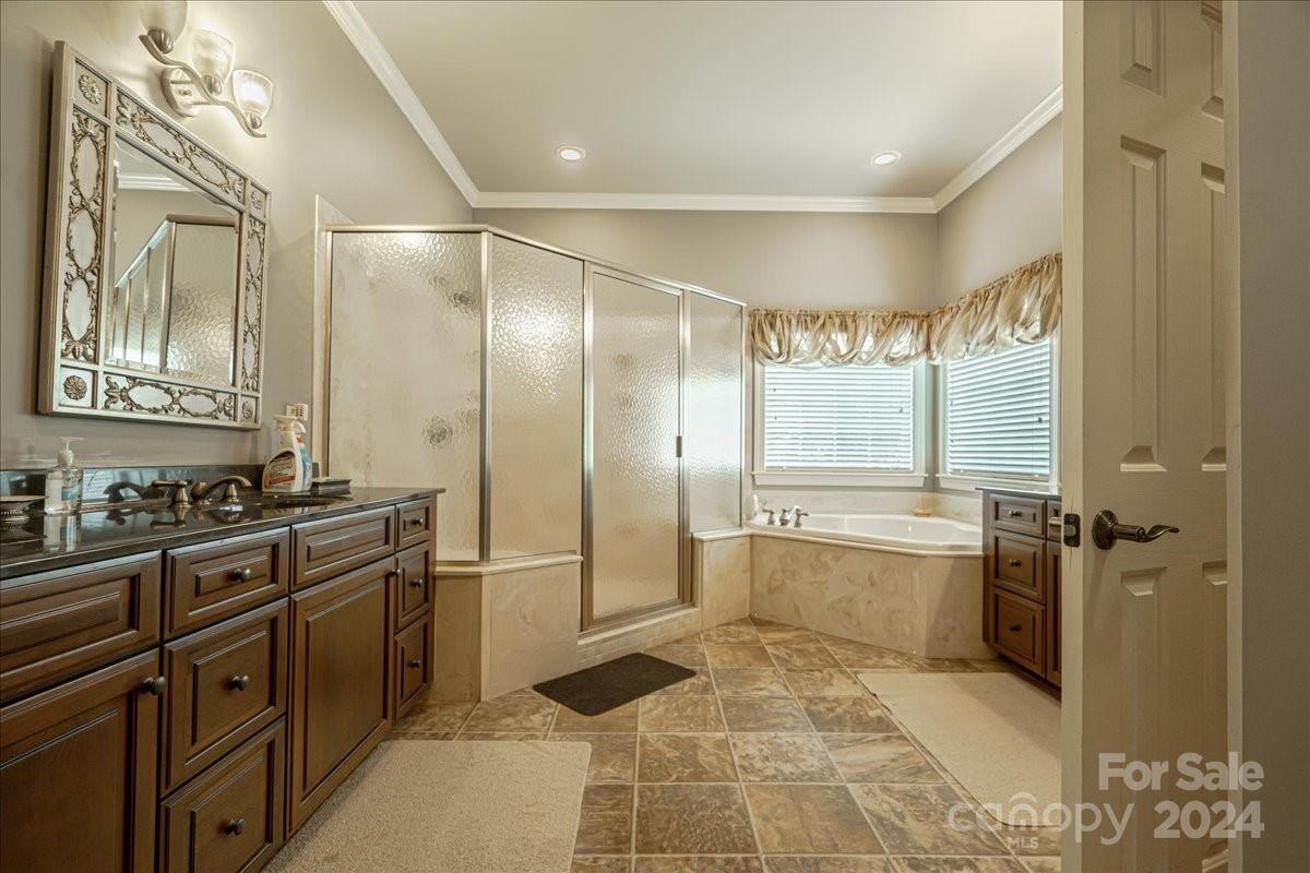545 State Rd S-13-756 Chesterfield, SC 29709 - Photo 37 of 45 a bathroom with a glass door shower a sink and a mirror