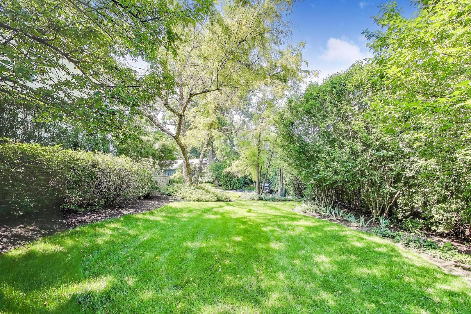 90 Riparian Road Highland Park, IL 60035 - Photo 51 of 76 a view of green field with trees in the background
