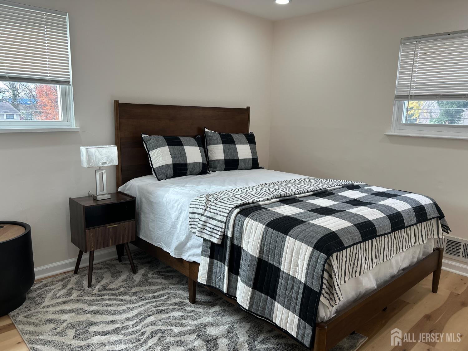 106 Boulevard West Old Bridge, NJ 07735 - Photo 23 of 34 a bedroom with a bed and wooden floor