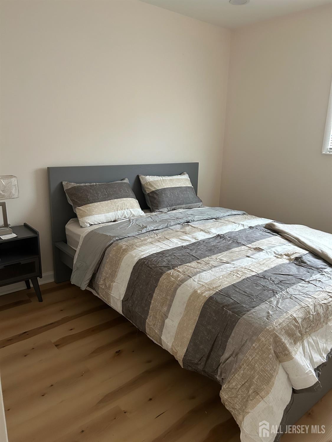 106 Boulevard West Old Bridge, NJ 07735 - Photo 25 of 34 a large bed sitting in a bedroom next to a window