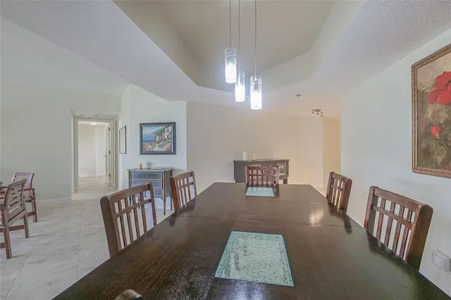 a kitchen with stainless steel appliances granite countertop a refrigerator and a stove