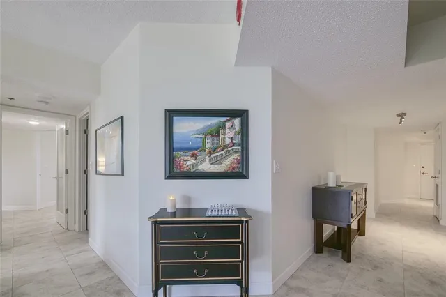 a spacious bedroom with a bed and a ceiling fan