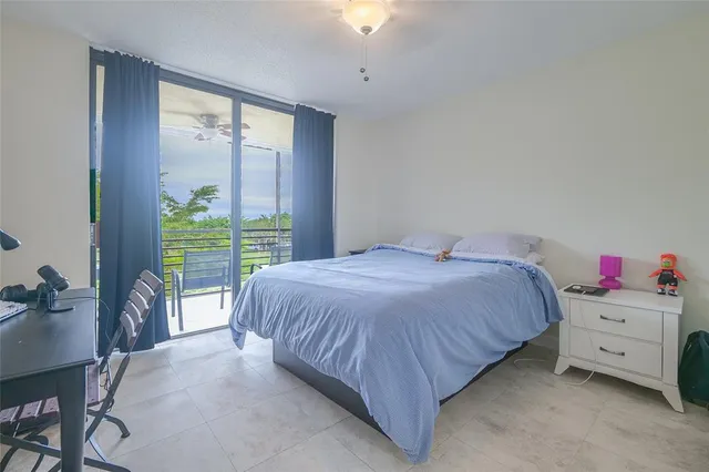 an aerial view of a residential houses with swimming pool and outdoor space