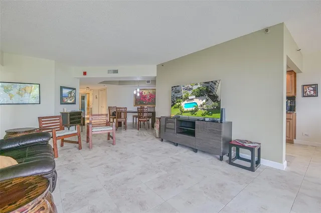 a view of a livingroom with furniture and windows