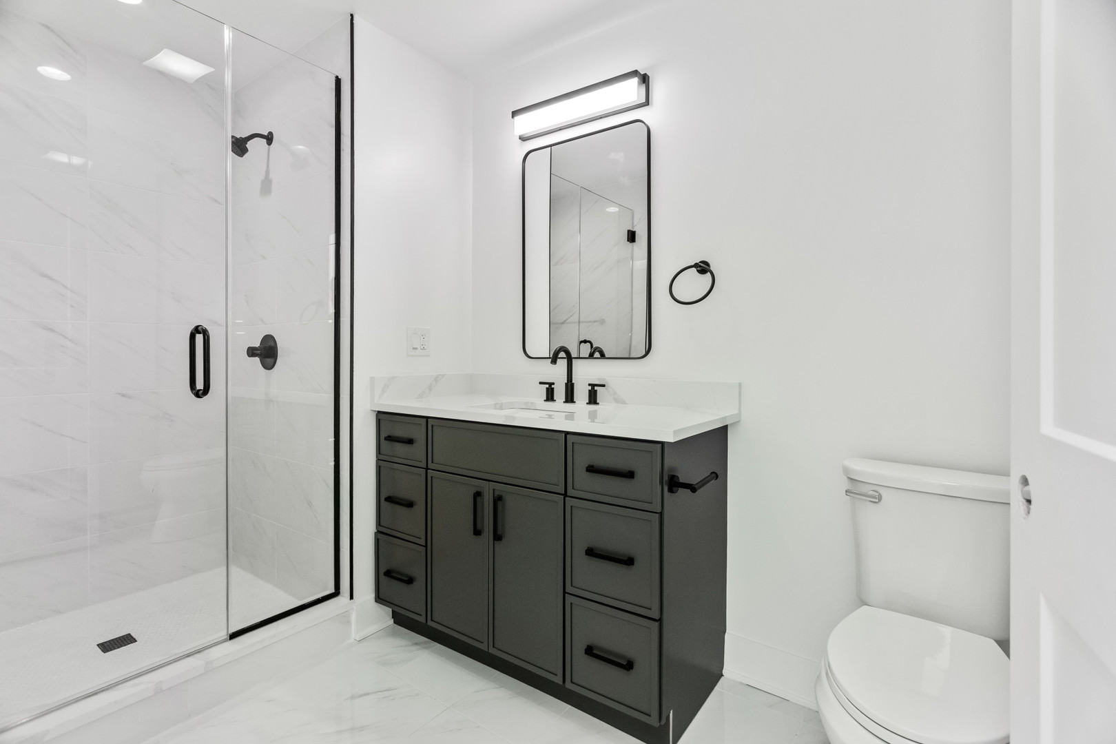 1453 Maple Avenue, Unit 201 Evanston, IL 60201 - Photo 18 of 25 a bathroom with a toilet a sink and mirror