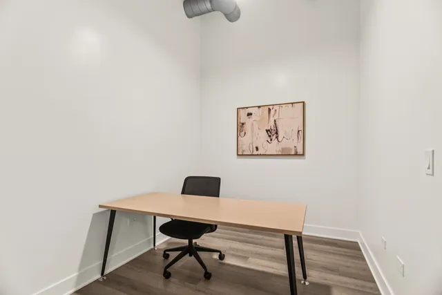 a view of a workspace with furniture