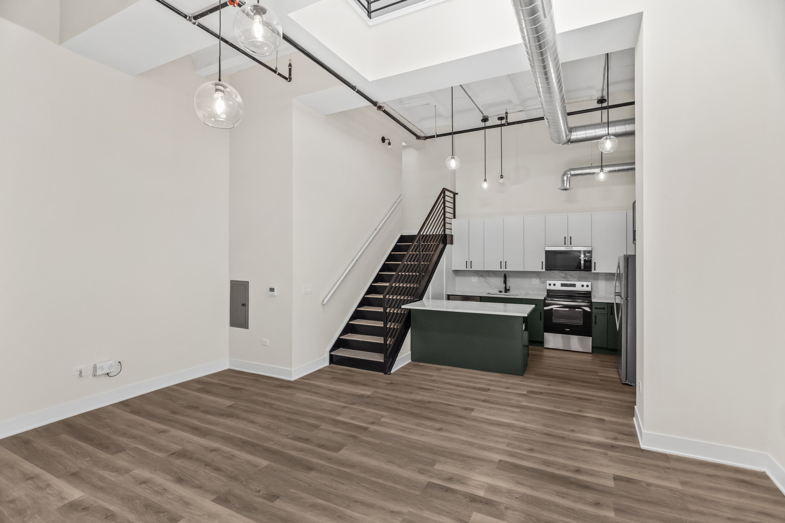 1453 Maple Avenue, Unit 201 Evanston, IL 60201 - Photo 5 of 25 a view of a kitchen with wooden floor and electronic appliances