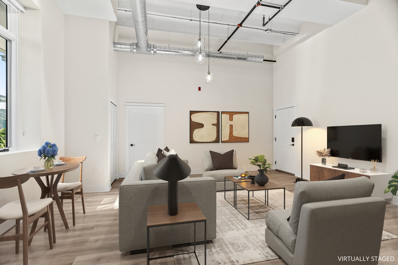 1453 Maple Avenue, Unit 201 Evanston, IL 60201 - Photo 6 of 25 a living room with furniture and a flat screen tv