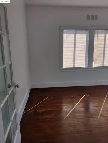 a view of a room with rack and a window