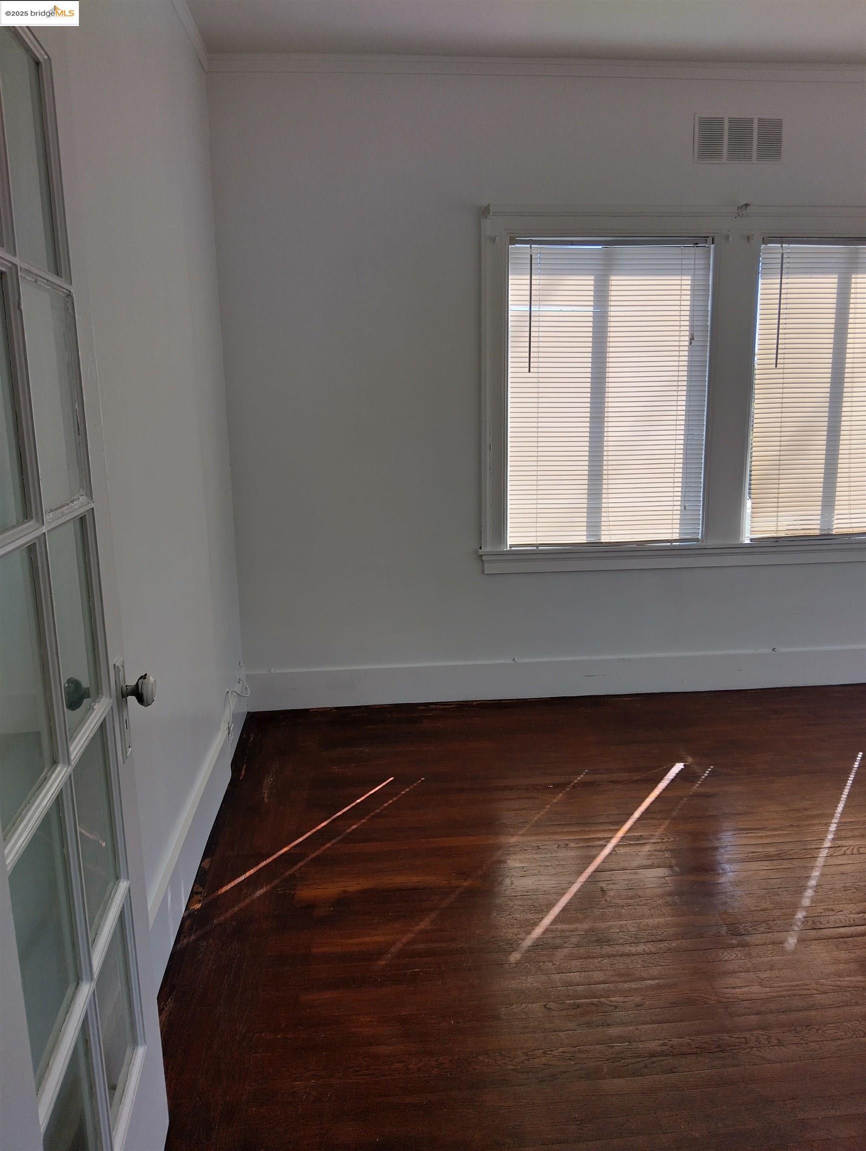 1864 11th Avenue Oakland, CA 94606 - Photo 11 of 46 a view of a room with rack and a window
