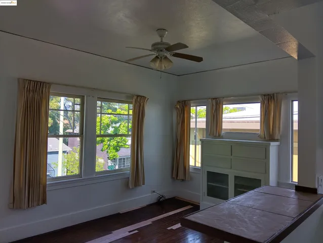 a living room with fireplace furniture and a window