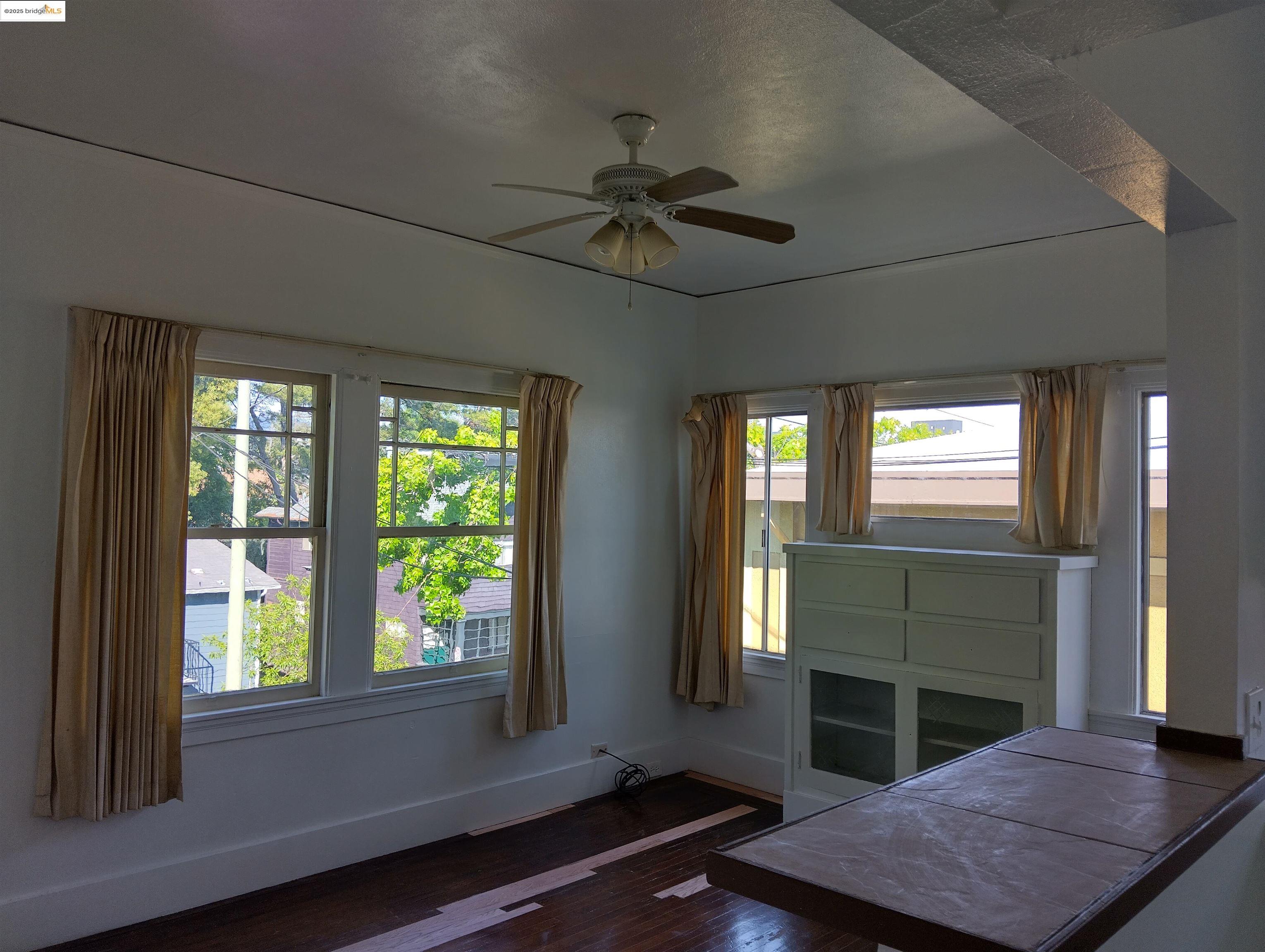 1864 11th Avenue Oakland, CA 94606 - Photo 17 of 46 a living room with fireplace furniture and a window
