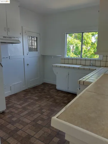 a view of cabinets and window