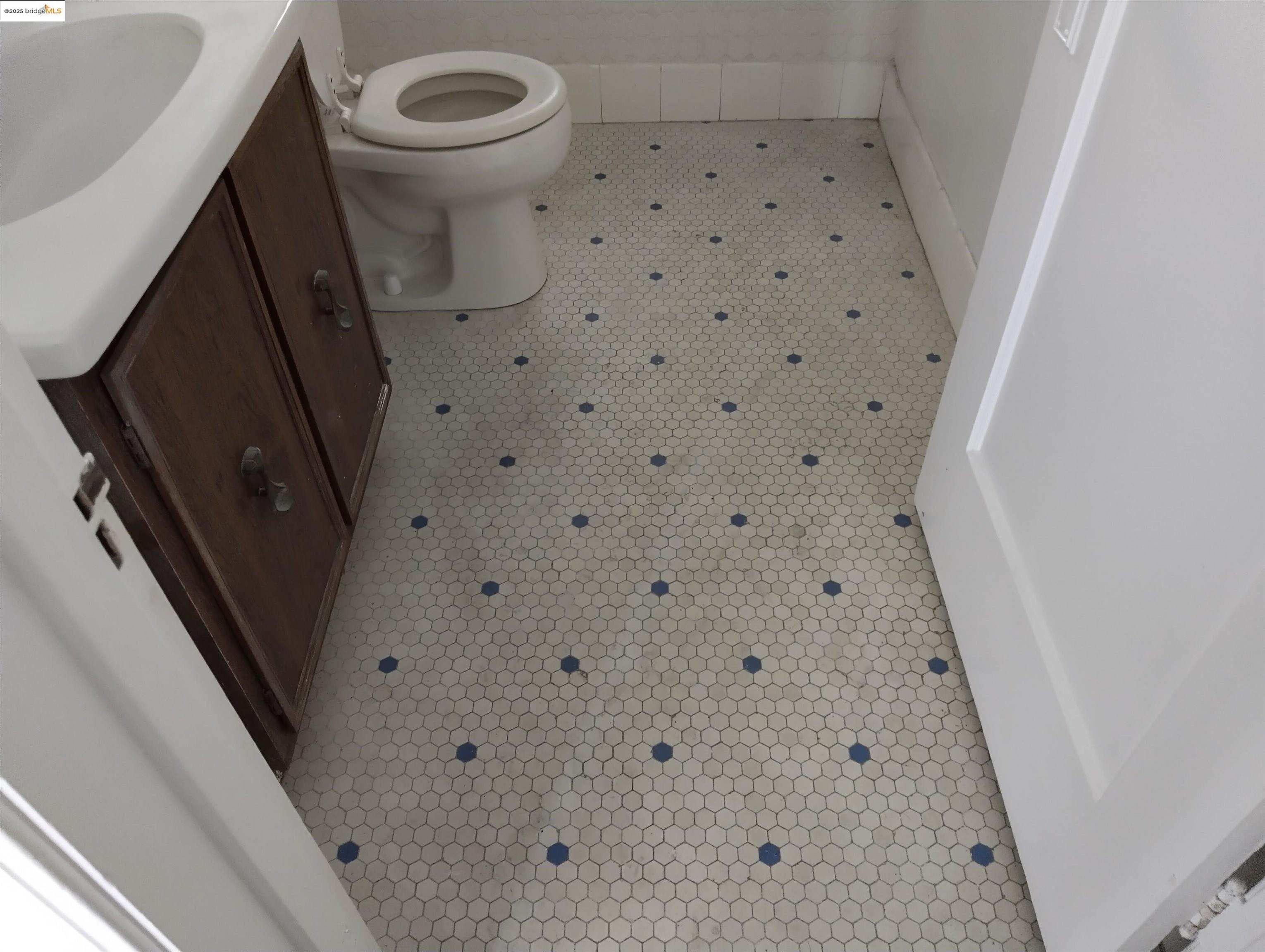 1864 11th Avenue Oakland, CA 94606 - Photo 31 of 46 a bathroom with a sink and a mirror