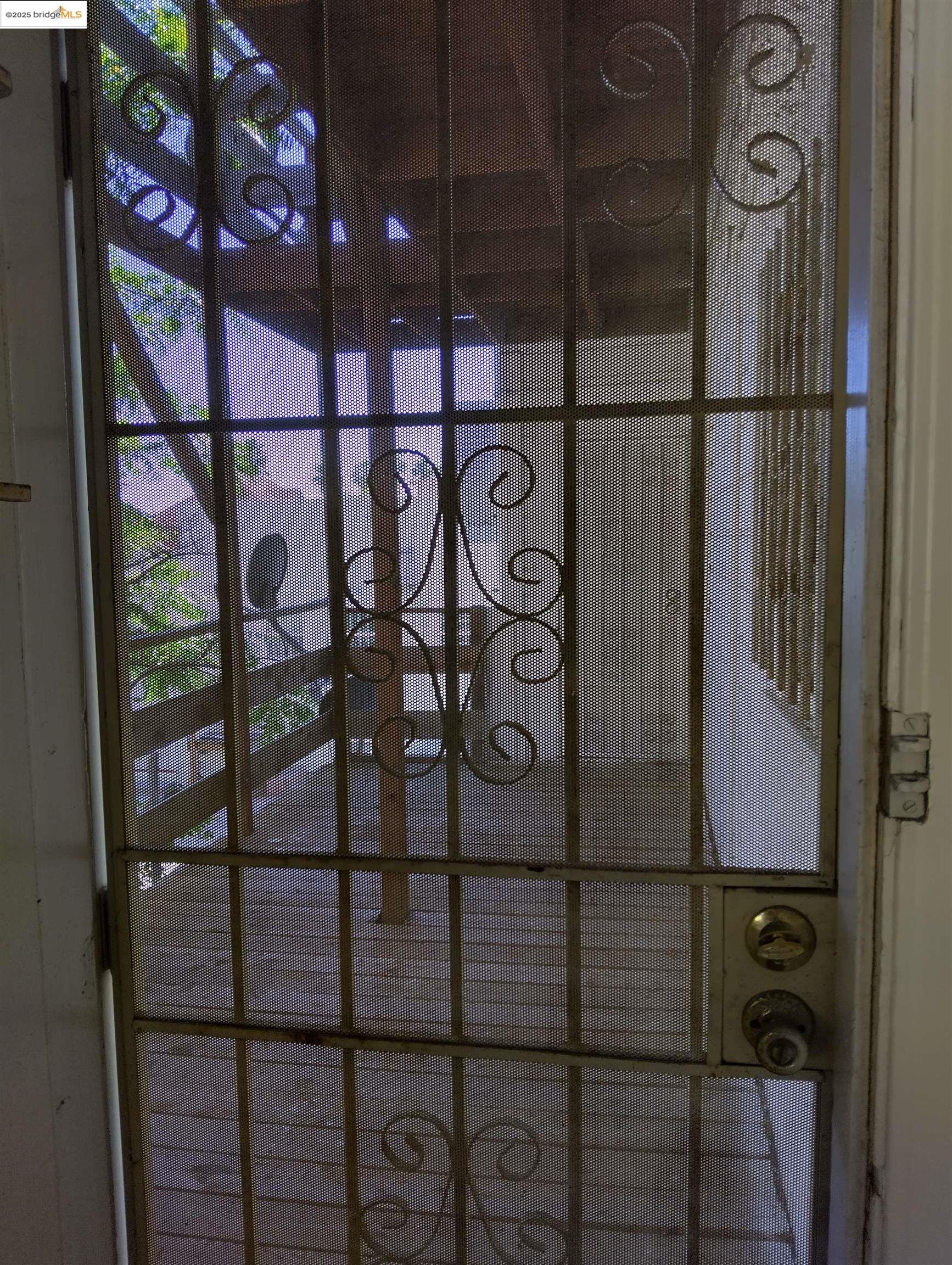 1864 11th Avenue Oakland, CA 94606 - Photo 33 of 46 a view of a glass door with a glass door