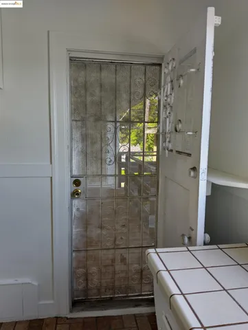 a bathroom with a shower and a sink