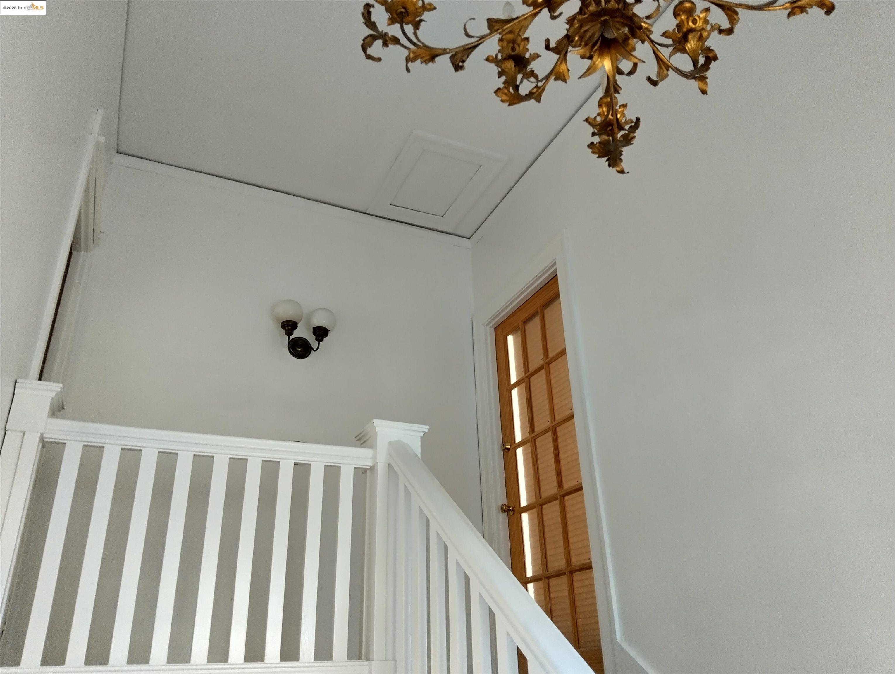 1864 11th Avenue Oakland, CA 94606 - Photo 7 of 46 a view of staircase with railing and white walls