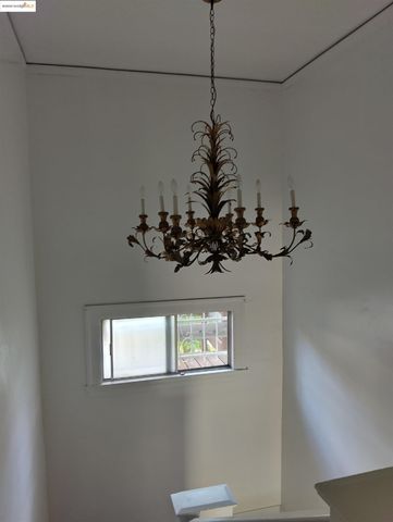 a vase of flowers sitting on a floor in a room