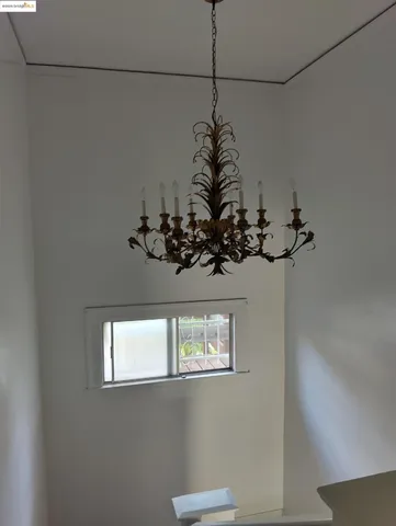 a vase of flowers sitting on a floor in a room