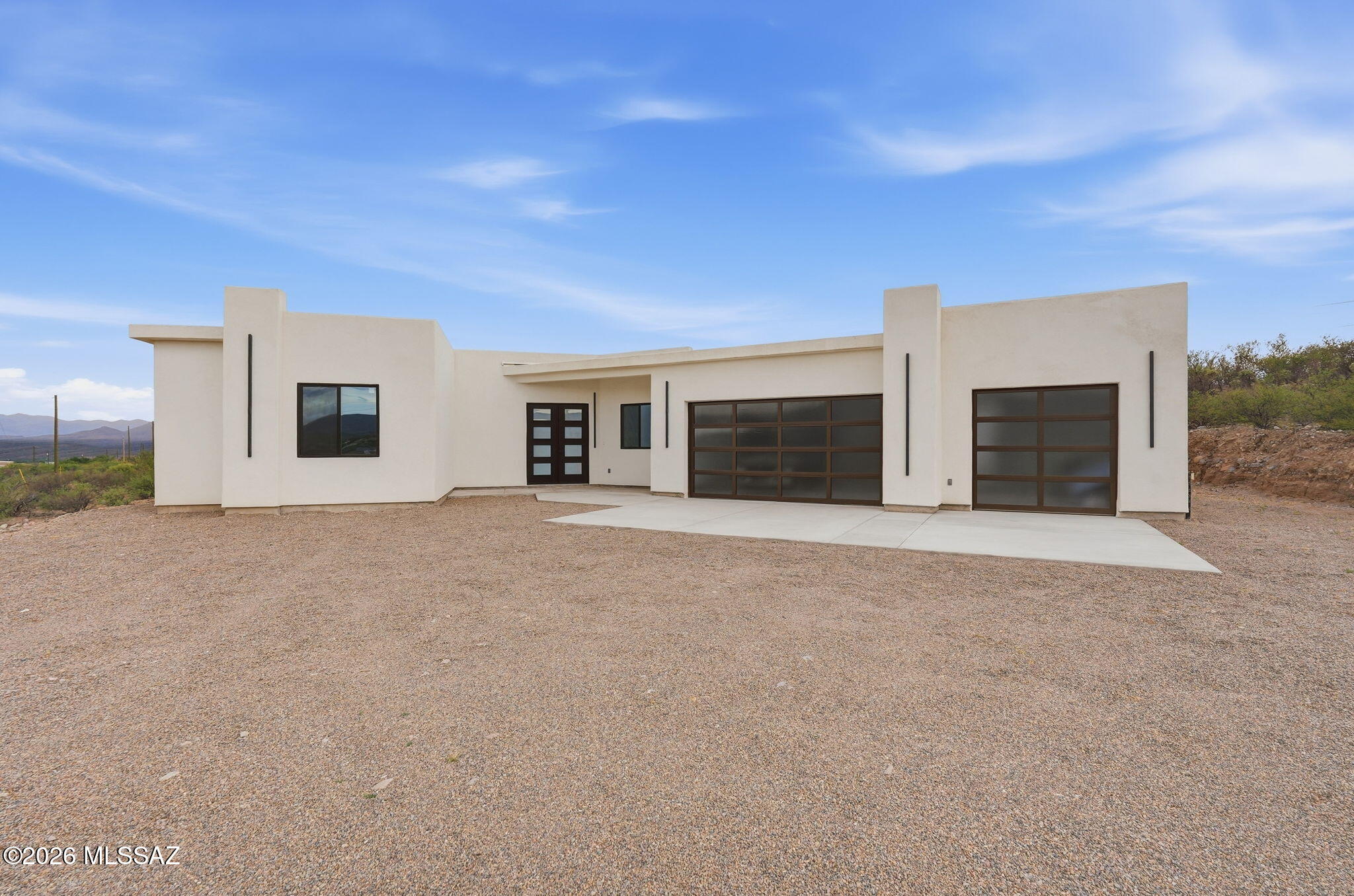 1786 Peralta Court Rio Rico, AZ 85648 - Photo 5 of 50 a view of a house with a garage and yard
