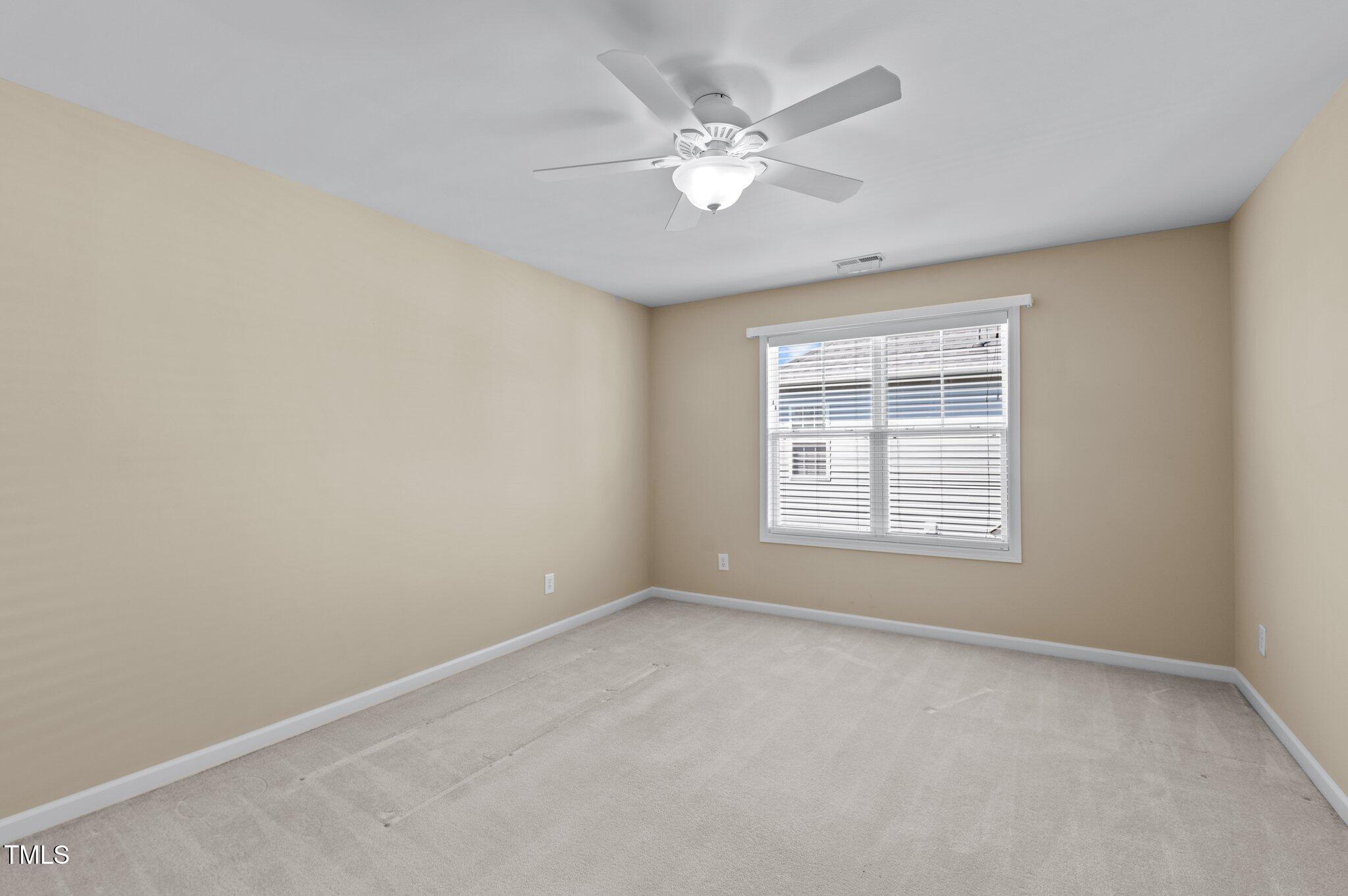9117 Cornwell Drive Wake Forest, NC 27587 - Photo 37 of 50 a view of an empty room with a window